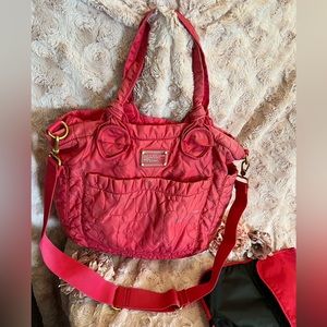 Marc Jacobs diaper bag with matching changing pad in lobster red.